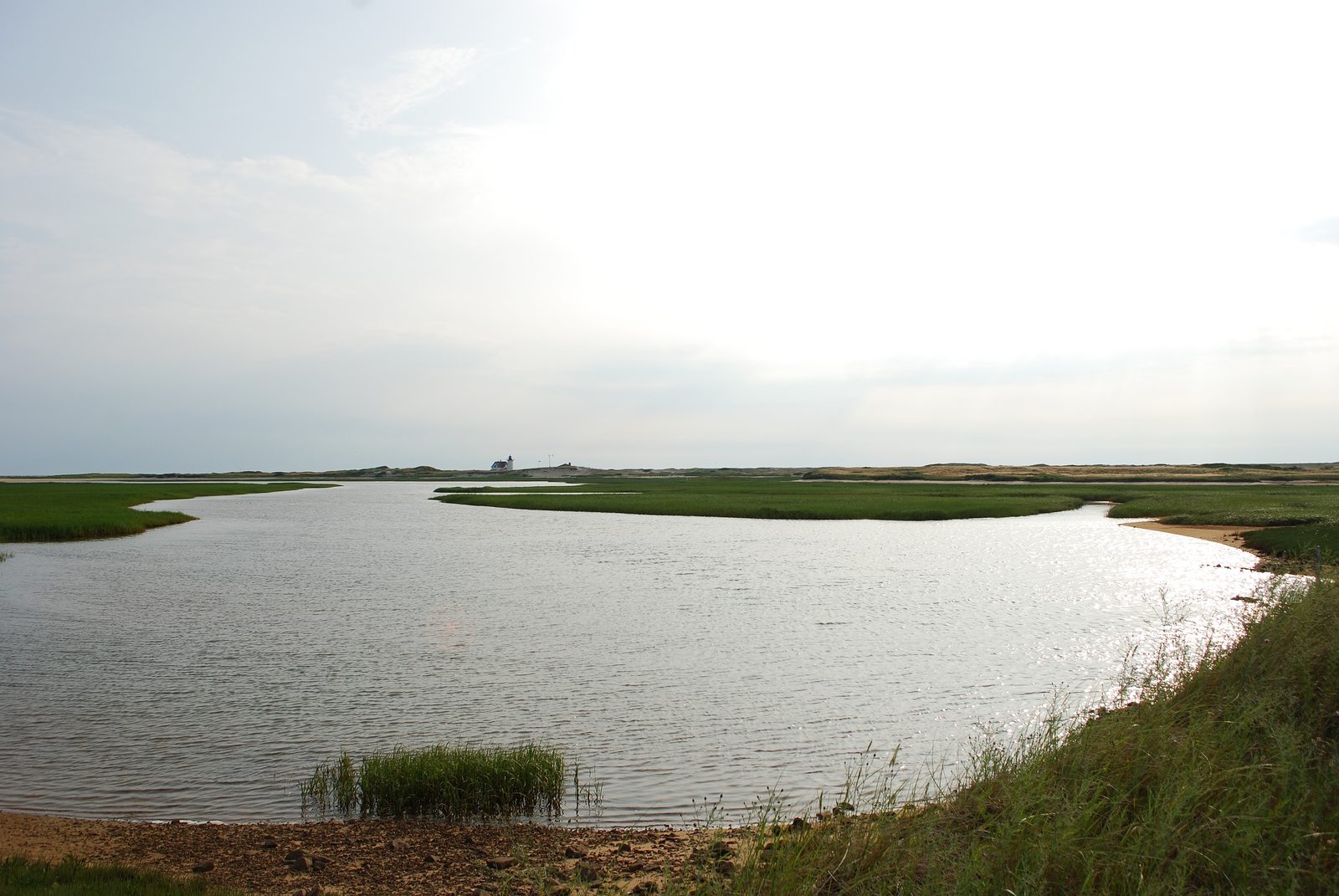Calm water winding through the salt marsh at Hatches Harbor